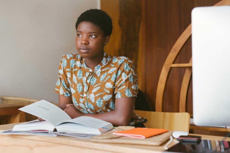 photo of woman holding book